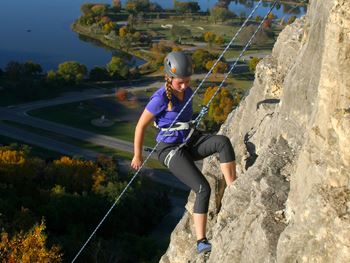 woman rock climbing at sugar loaf park